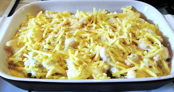 Chicken and Leek Pasta Bake topped with cheese roux sauce & grated Cheddar before grilling.