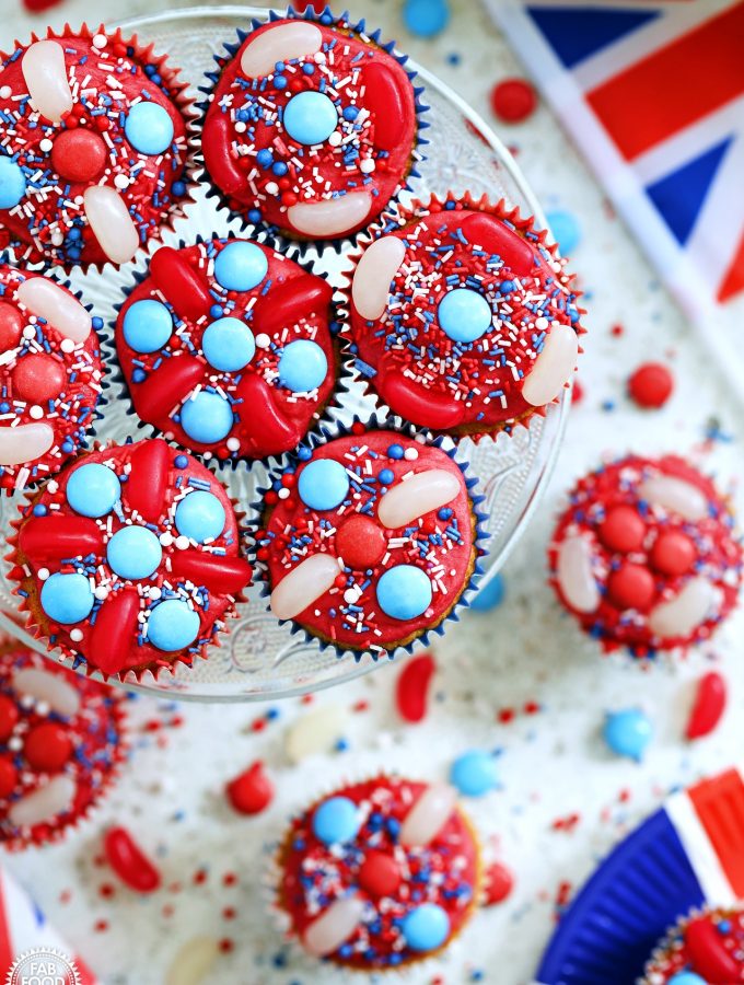 Aerial view of Jubilee Cupcakes on a cake stand with Union Jack flag and plate.