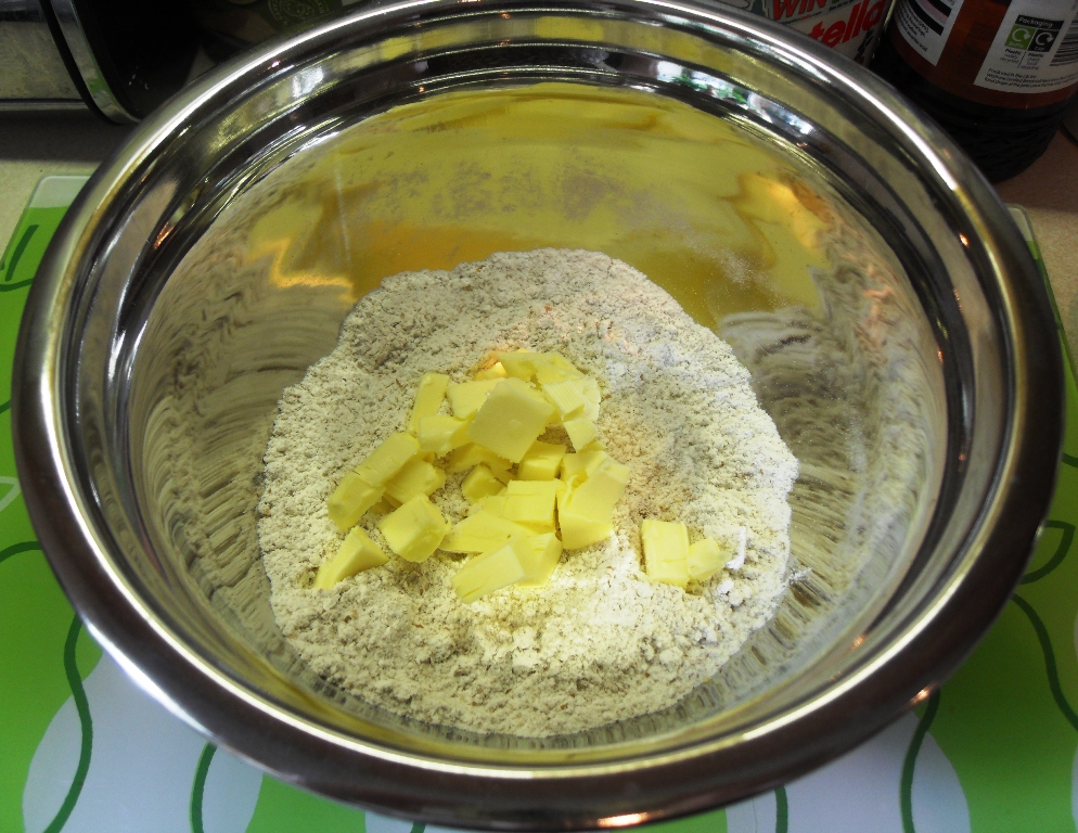 Bowl of flour, butter and sugar.