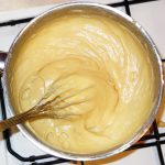 Choux pastry batter in pan after beating thoroughly.