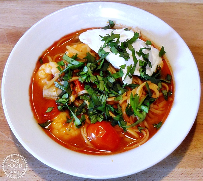Tom Yum Soup with Poached Egg in a bowl.