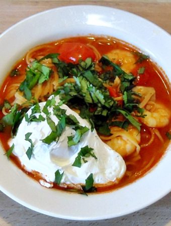 Tom Yum Soup with Poached Egg in a bowl.
