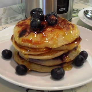 Blueberry & Banana Pancakes American Style with golden syrup and blueberries