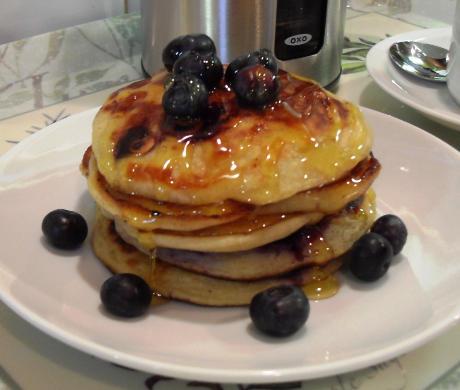 Blueberry & Banana Pancakes American Style with golden syrup and blueberries