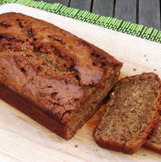Spelt Banana Bread sliced on a wooden board.