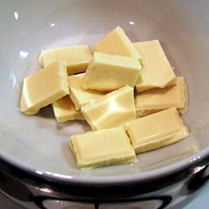 White chocolate being melted over a pan of hot water.
