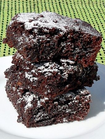 3 Specunana Brownies stacked on a plate.
