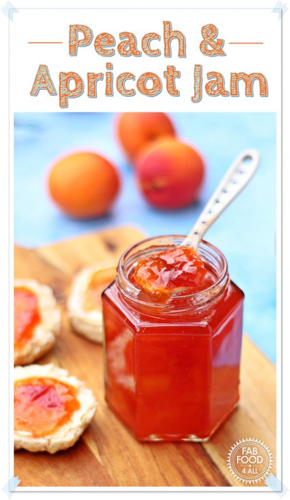 Jar of Peach & Apricot Jam with a spoon and scones on a wooden board surrounded by peaches, nectarines and apricots.