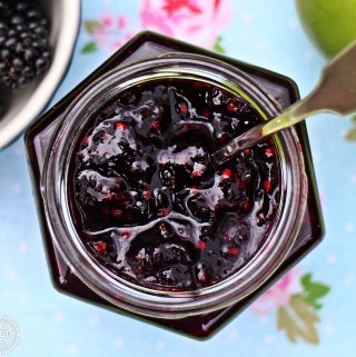 Easy Blackberry & Apple Jam in jar with spoon.