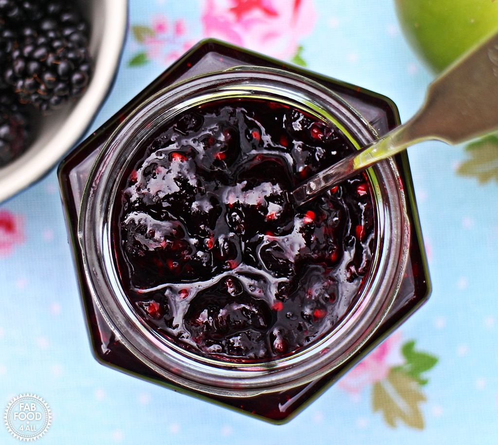 Easy Blackberry & Apple Jam in jar with spoon.