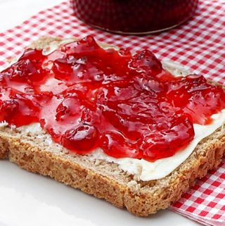 Strawberry, Raspberry & Redcurrant Jam on bread and butter.