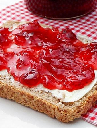 Strawberry, Raspberry & Redcurrant Jam on bread and butter.