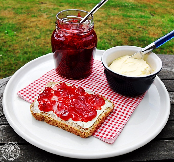 Strawberry, Raspberry & Redcurrant Jam on bread and butter.