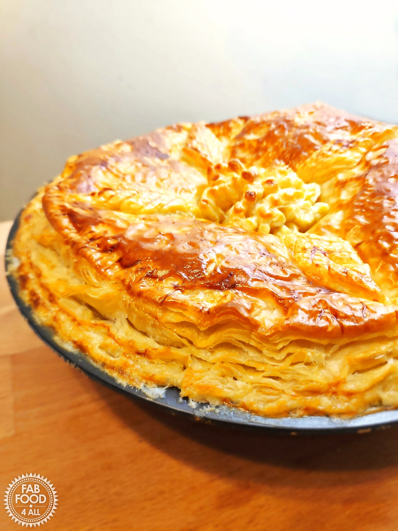 Sumptuous Turkey Pie showing knocked up layers on the side.