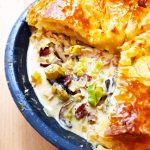 Close up of Sumptuous Turkey Pie with quarter of pie crust removed.