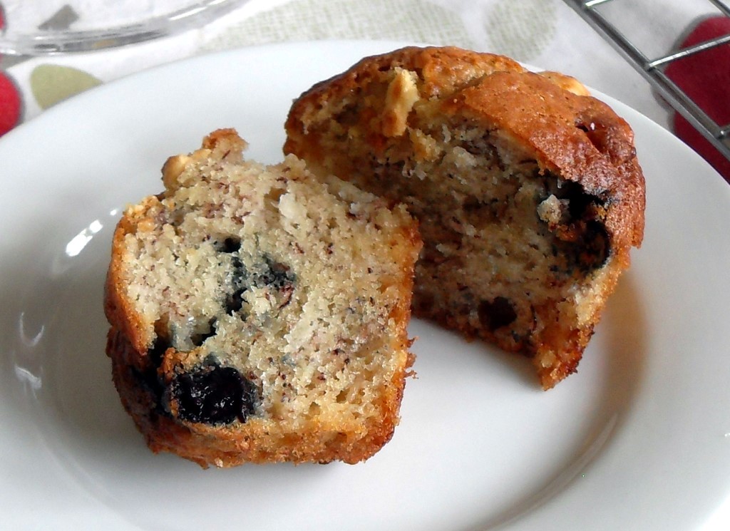 Blueberry, Banana and White Chocolate Muffins - cut in half on a plate.