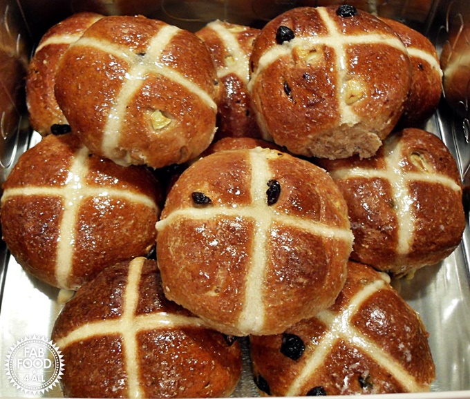 A stack of Wholemeal Apple Hot Cross Buns - fruity & delicious!