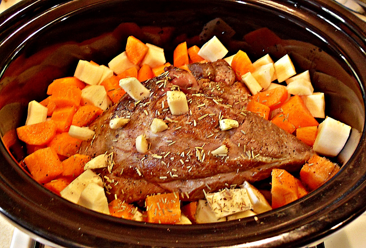Slow Cooker Pulled Lamb with White Wine & Root Vegetables in a slow cooker.