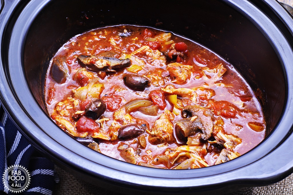 Italian slow-cooked chicken in a clay pot.