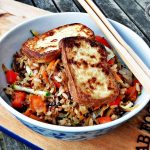 Warm Rice & Quinoa Salad with Pan Fried Tofu in a bowl with chopsticks