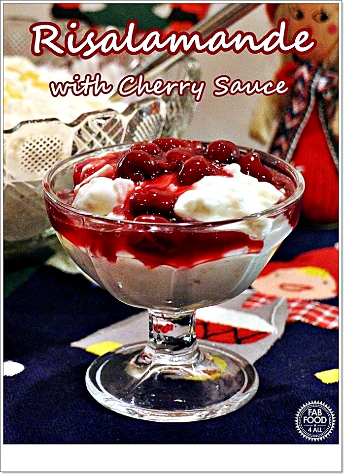 A portion of Risalamande (Danish Rice Pudding) and cherry sauce in a glass sundae dish. Pinterest image.
