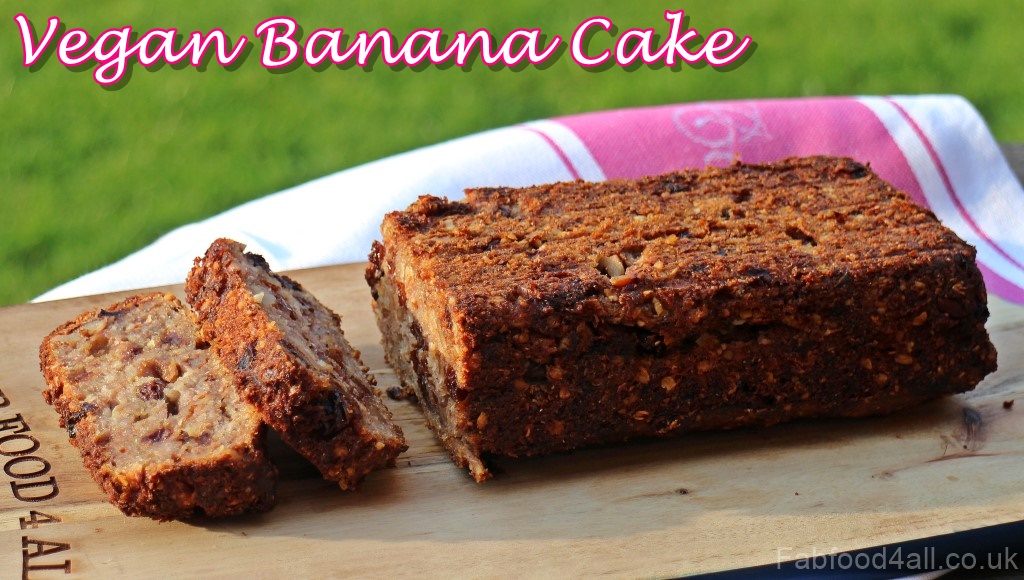 Vegan Banana Cake sliced at one end on a board.