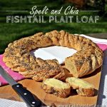Spelt and Fishtail Plait Loaf in a wreath shape, cut with buttered slices.