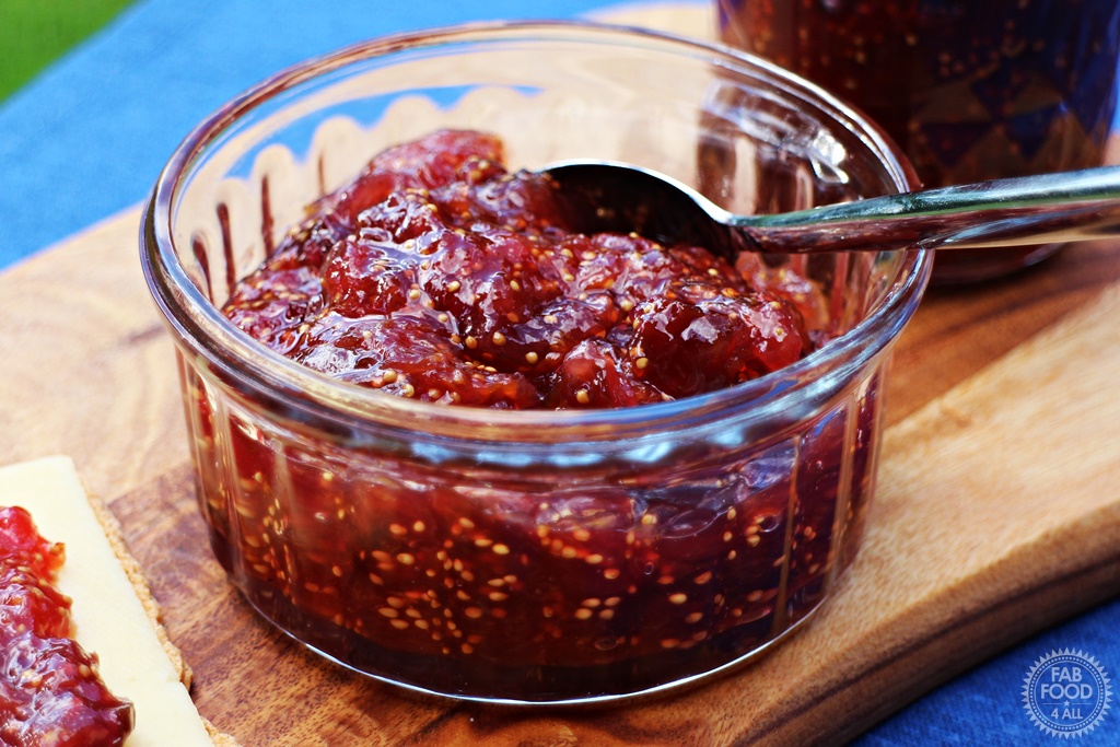 Simple Fig Jam in a glass dish with teaspoon.