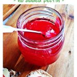 Easy Seedless Raspberry Jam in a jar with currant bun. Pinterest image.