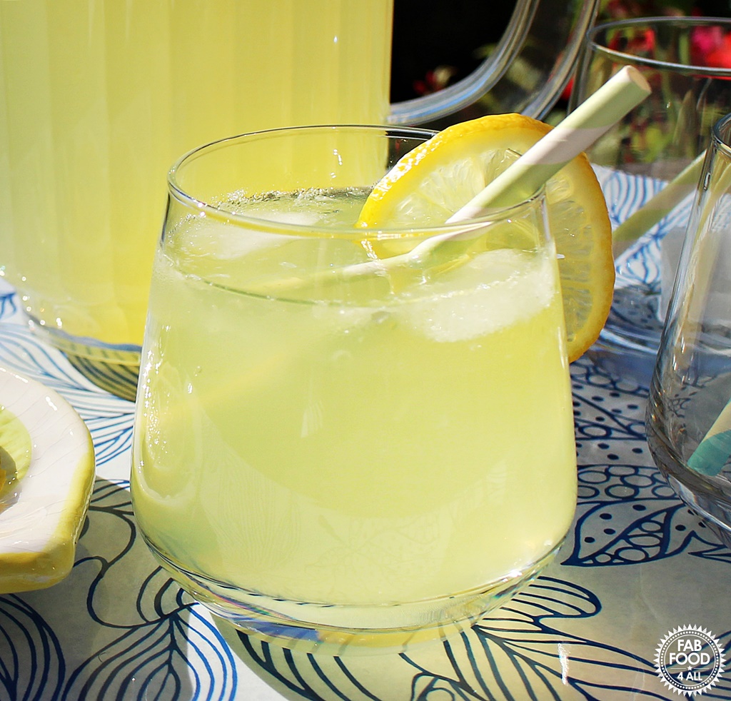 Old Fashioned Lemonade in a glass with ice and lemon.