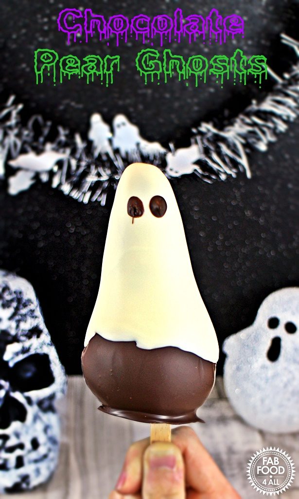 Chocolate Pear Ghost being held with spooky backdrop.