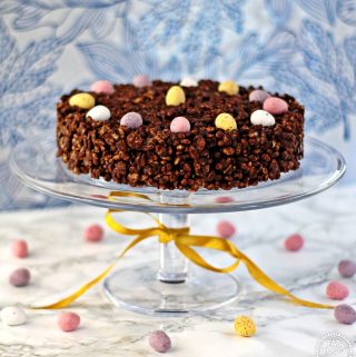 Mini Egg Chocolate Rice Crispy Cake on a glass pedestal.