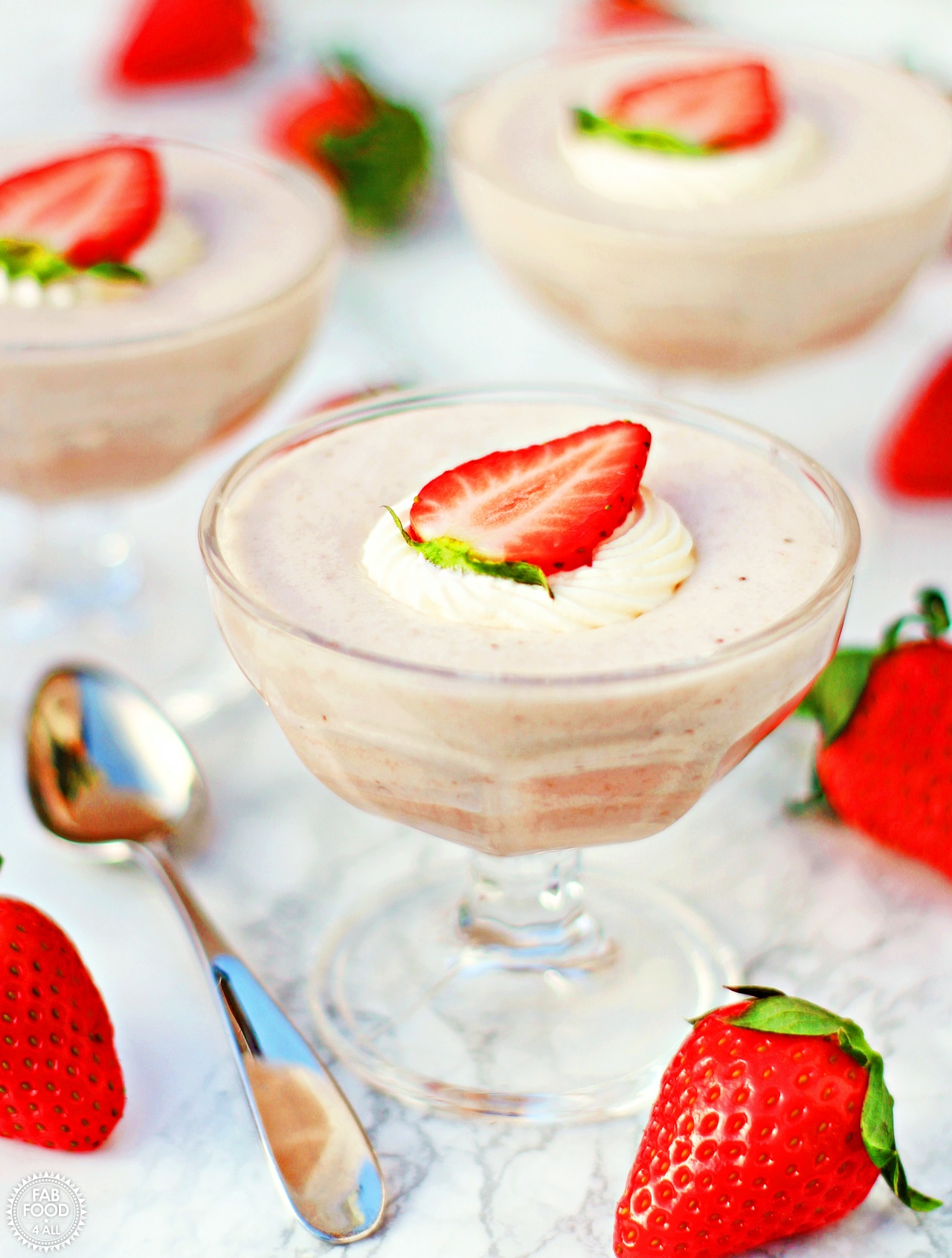 White Chocolate & Strawberry Mousse in glass goblets.