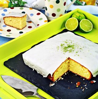 Easy Iced Lime Cake with cut slice.