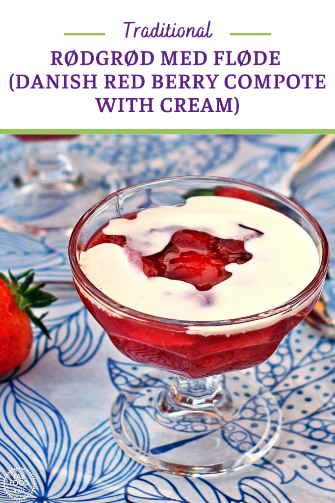 Rødgrød med fløde (Danish Red Berry Compote with Cream) in a glass sundae dish. Pinterest image.