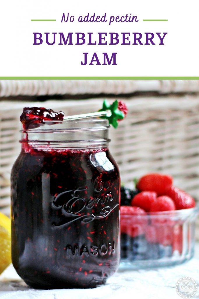 Tutti Frutti Jam in a jar with berries in background Pinterest image.