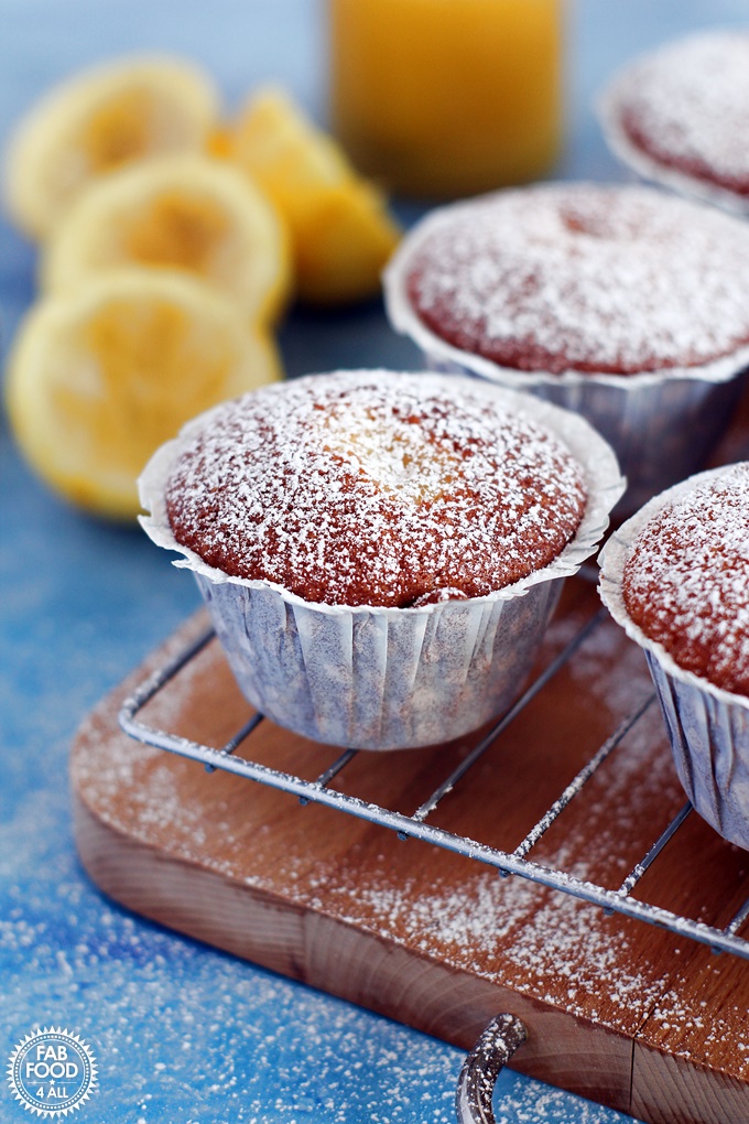 Easy Lemon Curd Muffins with a lemon curd centre and dusted with icing sugar. on a wire rack