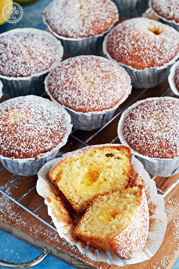Easy Lemon Curd Muffins with a lemon curd centre and dusted with icing sugar. on a wire rack