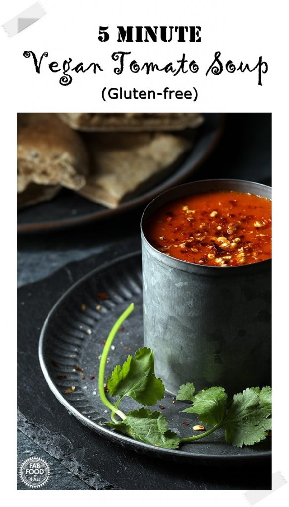 5 Minute Vegan Tomato Soup in a tin mug on tin plate with cut flatbread. Pin image.