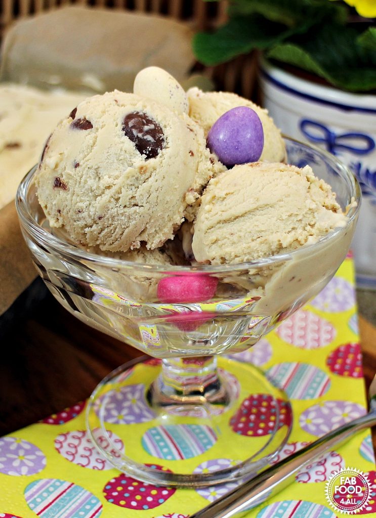 Caramel Ice Cream with Easter Eggs in a glass stemmed dish.