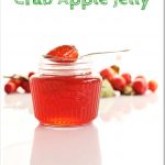 Crab Apple Jelly Pinterest Image - jar with spoon on top.