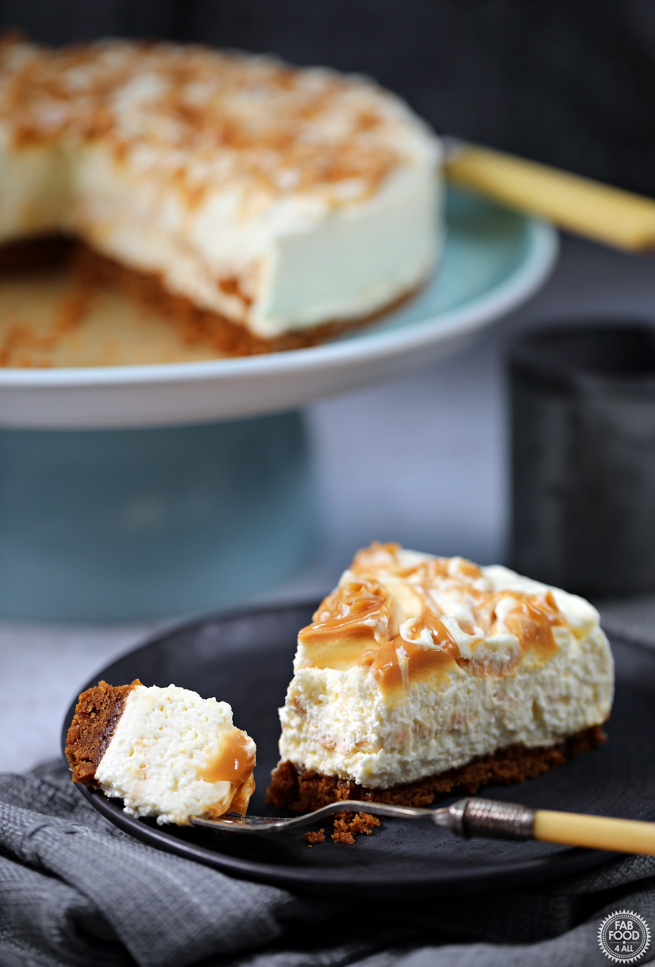Salted Caramel Cheesecake (no-bake) with cut slice with forkful on a plate.