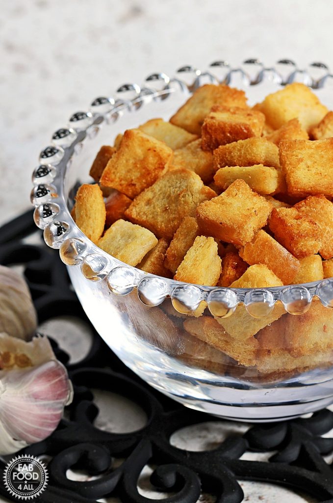 Close up of Easy Garlic Croutons in a glass bowl.