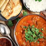 Easy Slow Cooker Beef Curry with basmati rice, naan bread and mango chutney.