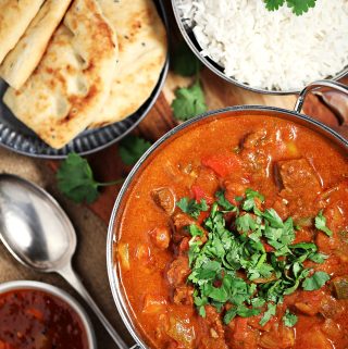 Easy Slow Cooker Beef Curry with basmati rice, naan bread and mango chutney.