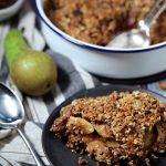 Pear, Chocolate & Ginger Crumble in dish & served on a plate.