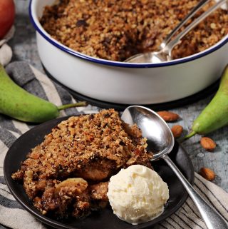 Pear, Chocolate & Ginger Crumble served with ice cream.