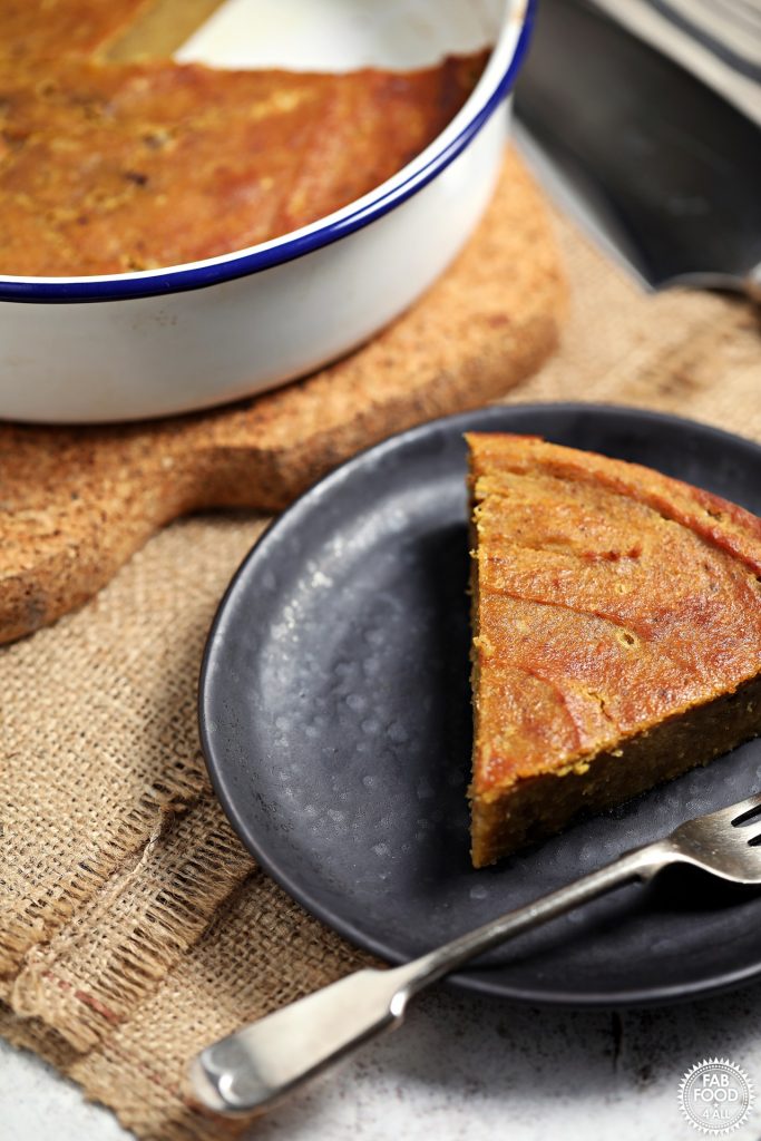 Easy Pumpkin Pie Pudding in a pie dish plus slice on a plate.