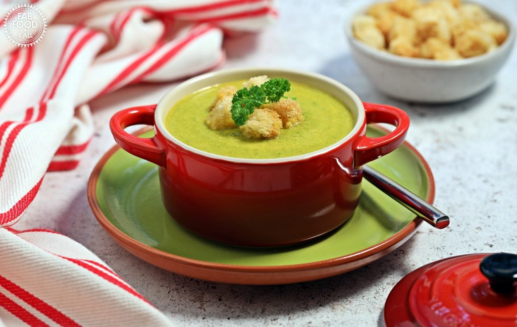 Bowl of Carrot & Parsley Soup with garlic croutons.