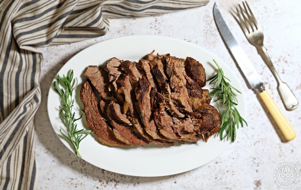 Slow Cooked Beef Brisket on a serving dish.